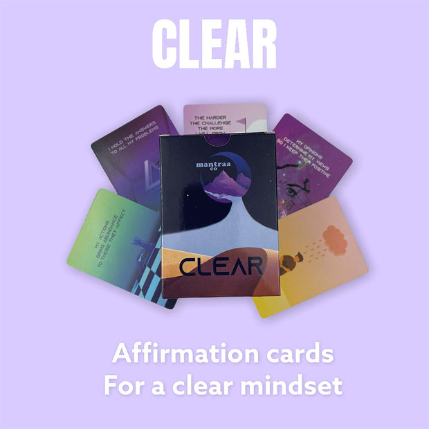 Clear affirmation cards for mindset. Affirmation deck on top of affirmation cards with purple background.