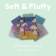 Soft & fluffy affirmation cards for kids. Mantraa co affirmation deck on top of affirmation cards with mint green background.